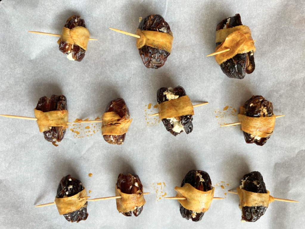 Arrange dates on a parchment-lined, rimmed baking sheet Place in 450 degree oven and bake for 5 minutes.
