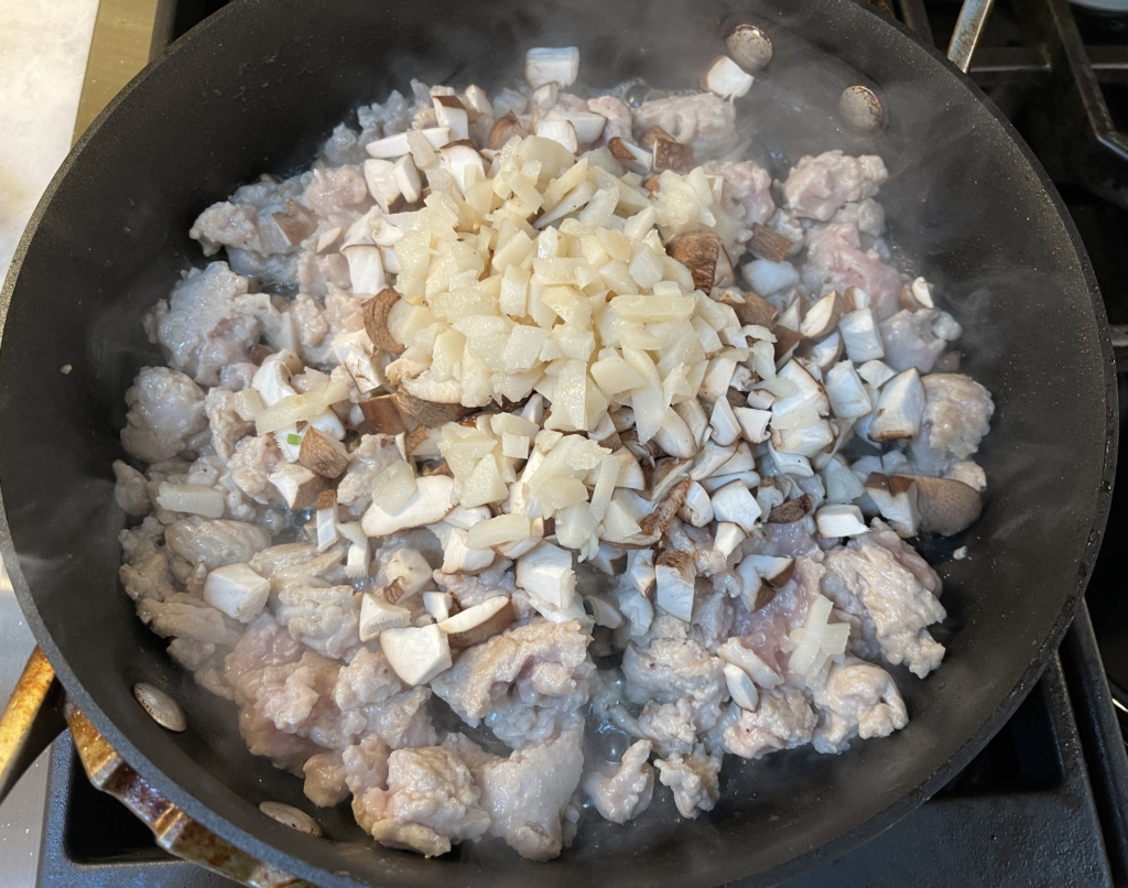 Then add mushrooms and water chestnuts. Saute for 2-3 minutes.
