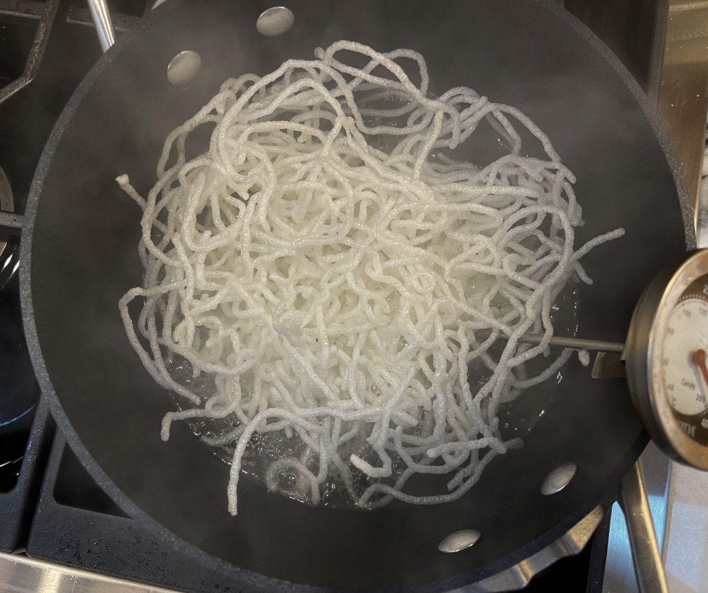 Cook for 10 seconds or until noodles puff up. (This happens very quickly). Remove noodles with tongs and place on a paper towel-lined plate.