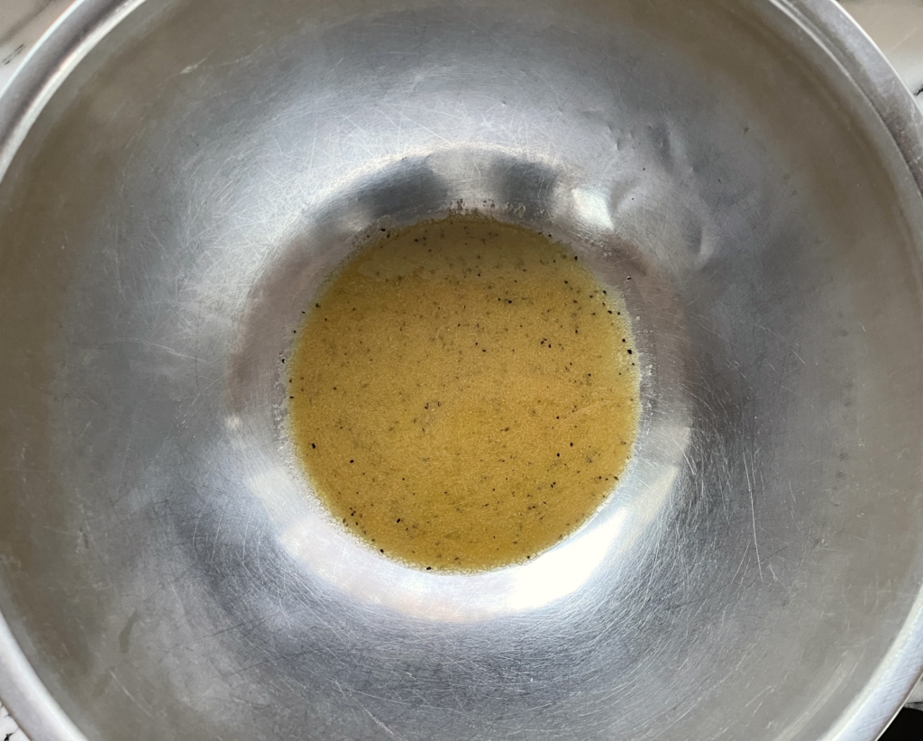 Before serving, place vinaigrette in the bottom of a large bowl.