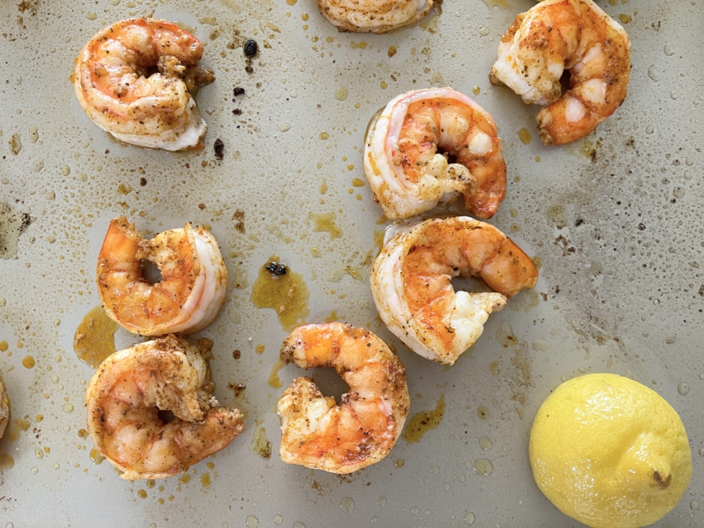 Place baking sheet on the top rack and cook shrimp and lemons for 1-1.5 minutes. Set a timer! The shrimp will need to be removed from the oven before the lemons. Continue cooking the lemons until they have charred in some spots, approximately an additional 4-5 minutes.