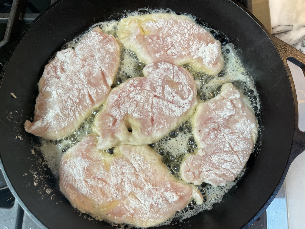 Place chicken in a large non stick or cast iron pan over medium heat. Cook for 2-3 minutes.