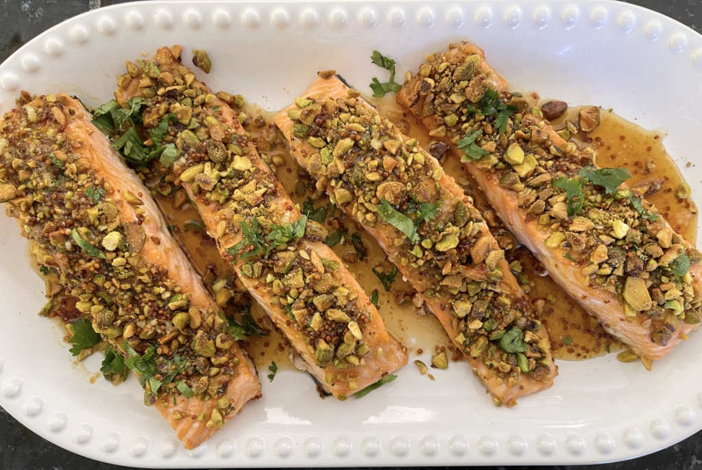 Carefully remove the salmon fillets with a large spatula and transfer them to a large platter or individual plates. Drizzle mustard sauce over the fillets, garnish with any leftover parsley, and serve remaining sauce on the side.