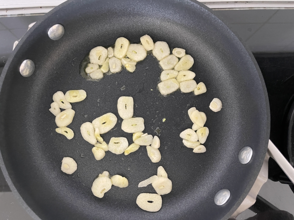 Place garlic in a small non-stick pan over medium low heat.