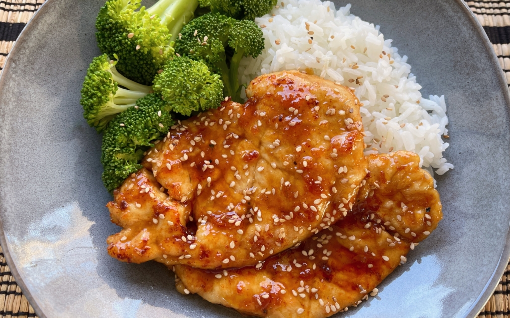 Sticky Honey Garlic Chicken Breasts - Transfer chicken to a plate and serve with a vegetable and rice.