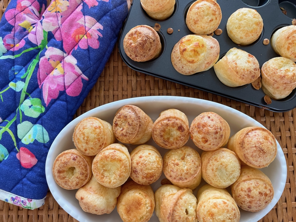 Homemade Brazilian Mini Cheese Rolls (Gluten Free). Serve rolls in a basket or bowl.
