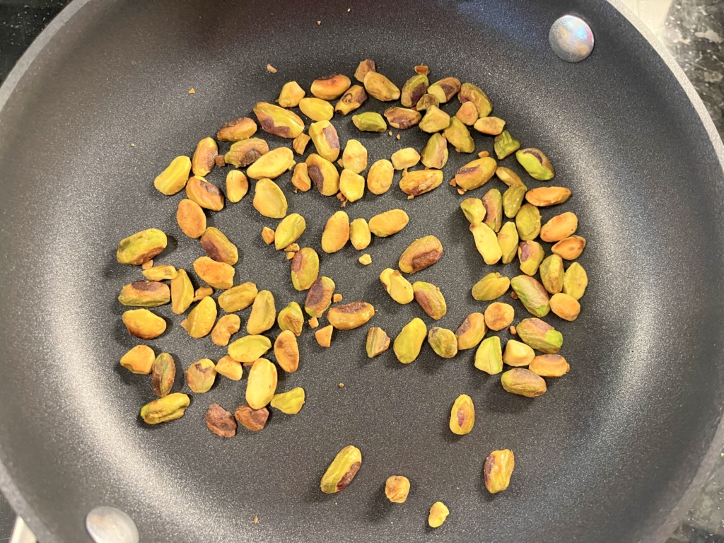 Place the pistachios in a small pan over medium-low heat and cook pistachios until they are toasted and fragrant, approx 3 minutes.