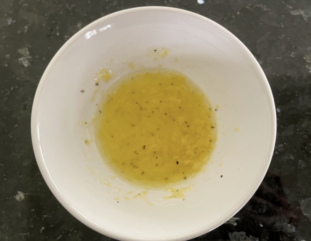 Make the lemon vinaigrette by whisking lemon zest and juice together with 2 tablespoons olive oil. Set aside.