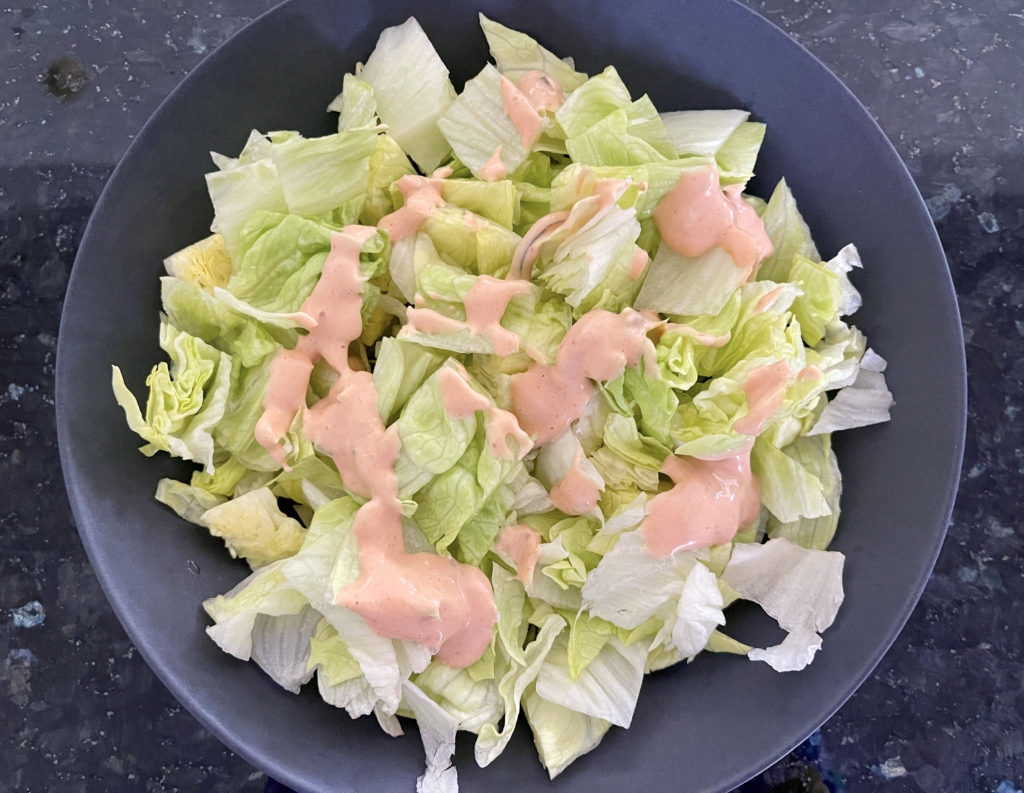 Add some dressing on top of the lettuce.