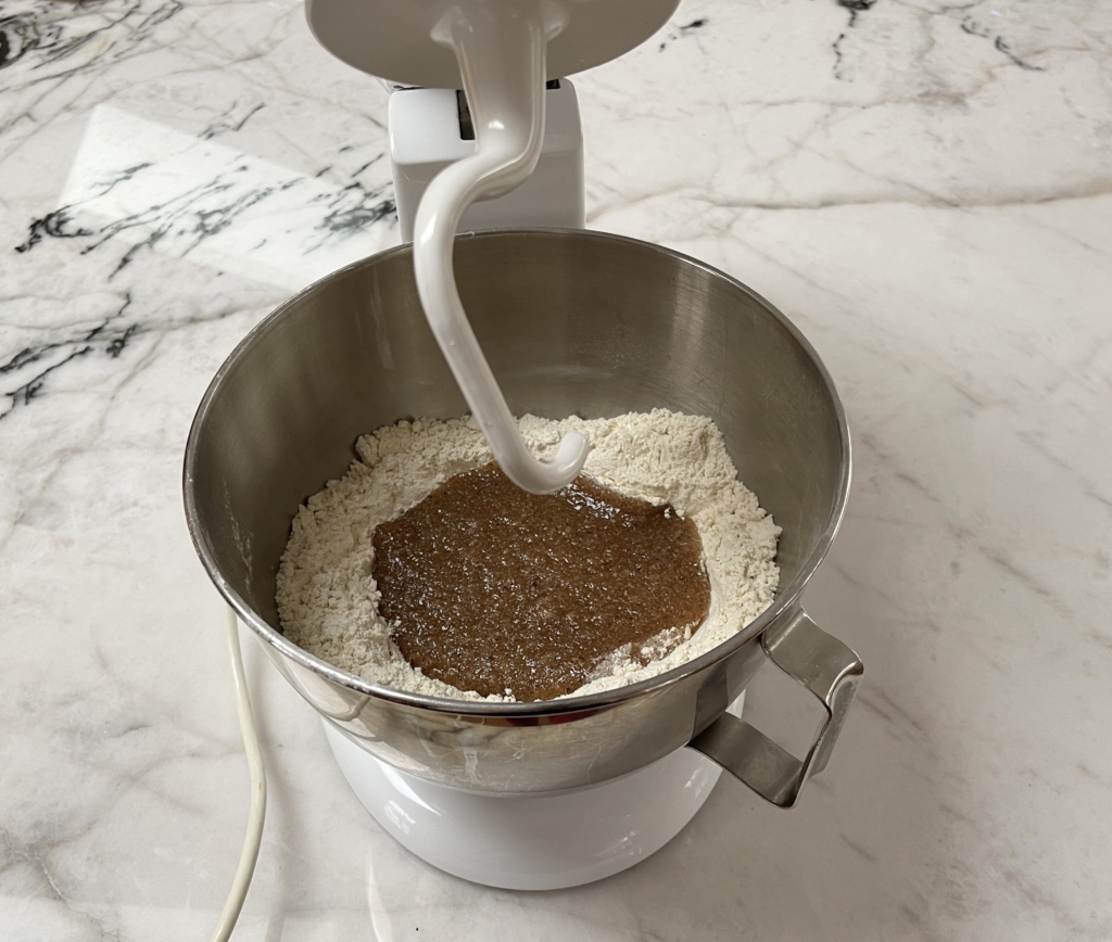 Place the bowl into the mixer and insert the dough hook. 