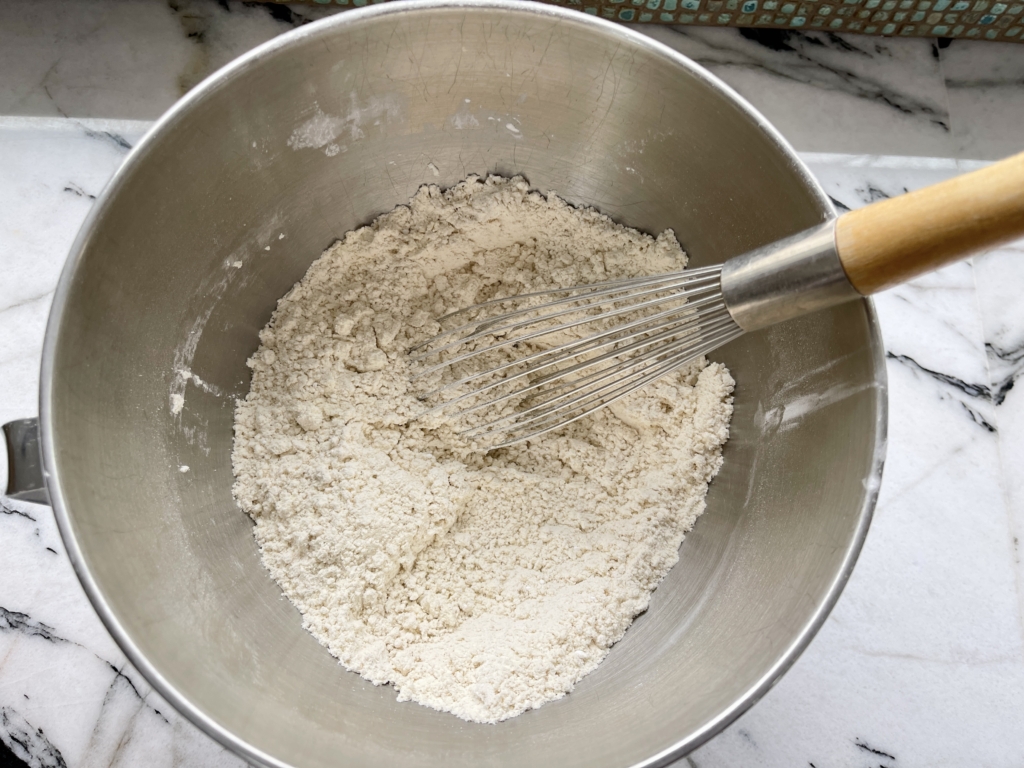 In the bowl of a stand mixer, whisk together the millet flour, tapioca starch, sorghum flour, sugar, instant yeast and salt.