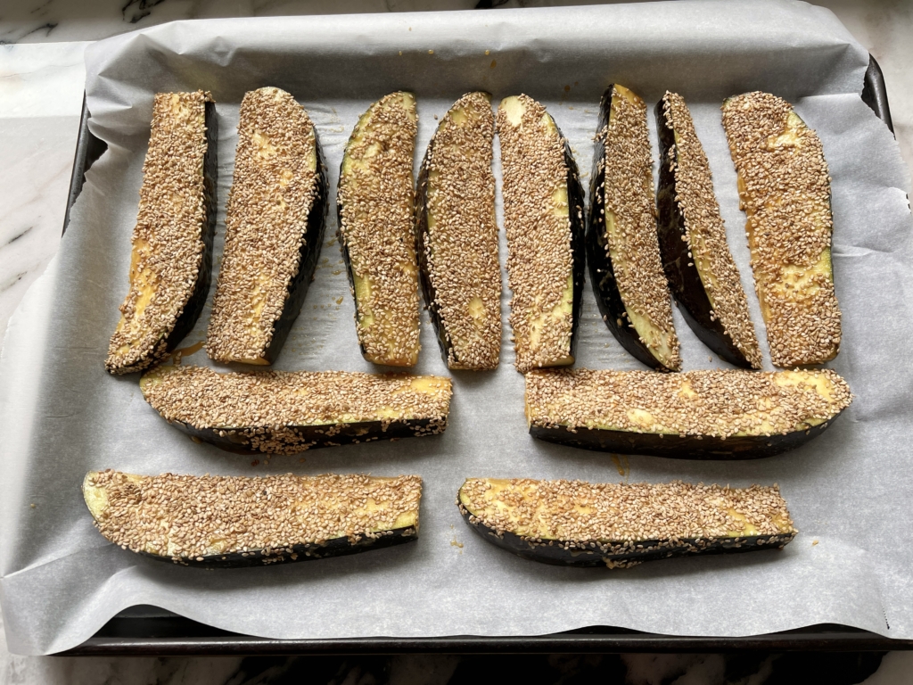 Return the eggplant wedges to the baking sheet, sesame side up and bake for 15 minutes.