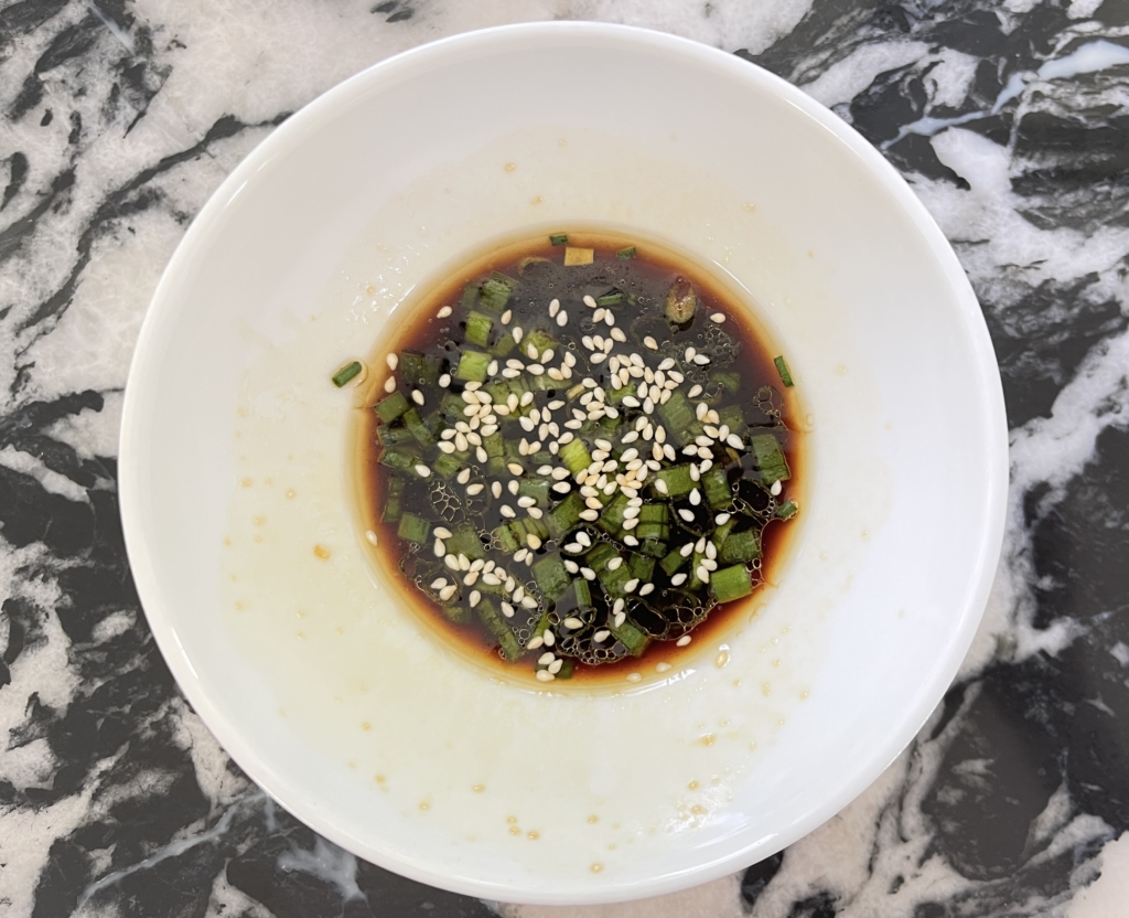 While the pancakes are cooking, make the dipping sauce. Place gluten free soy sauce, rice vinegar, sesame oil, sugar, scallions, and sesame seeds (if desired) in a small bowl. Combine sauce ingredients and set aside until ready to serve.