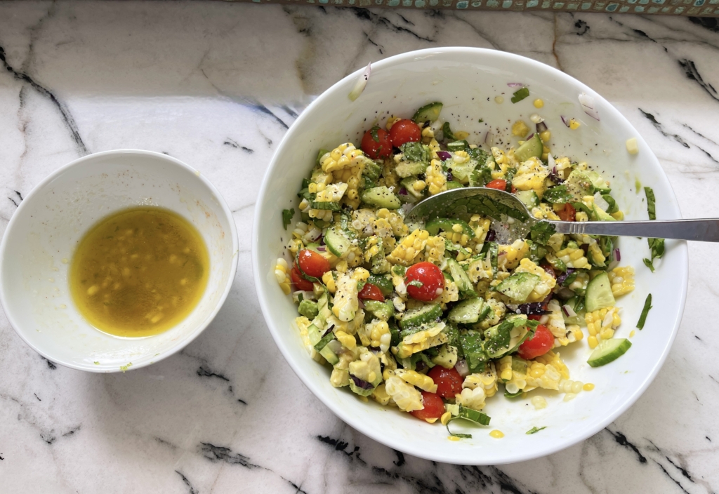 Drizzle half of the dressing onto the corn mixture and gently combine. Add more dressing if needed. 