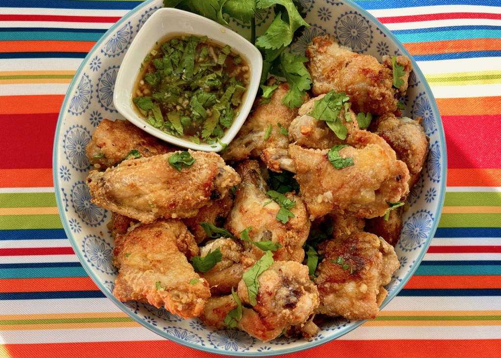 Transfer wings to a platter and serve immediately with any remaining sauce served on the side as a dipping sauce.