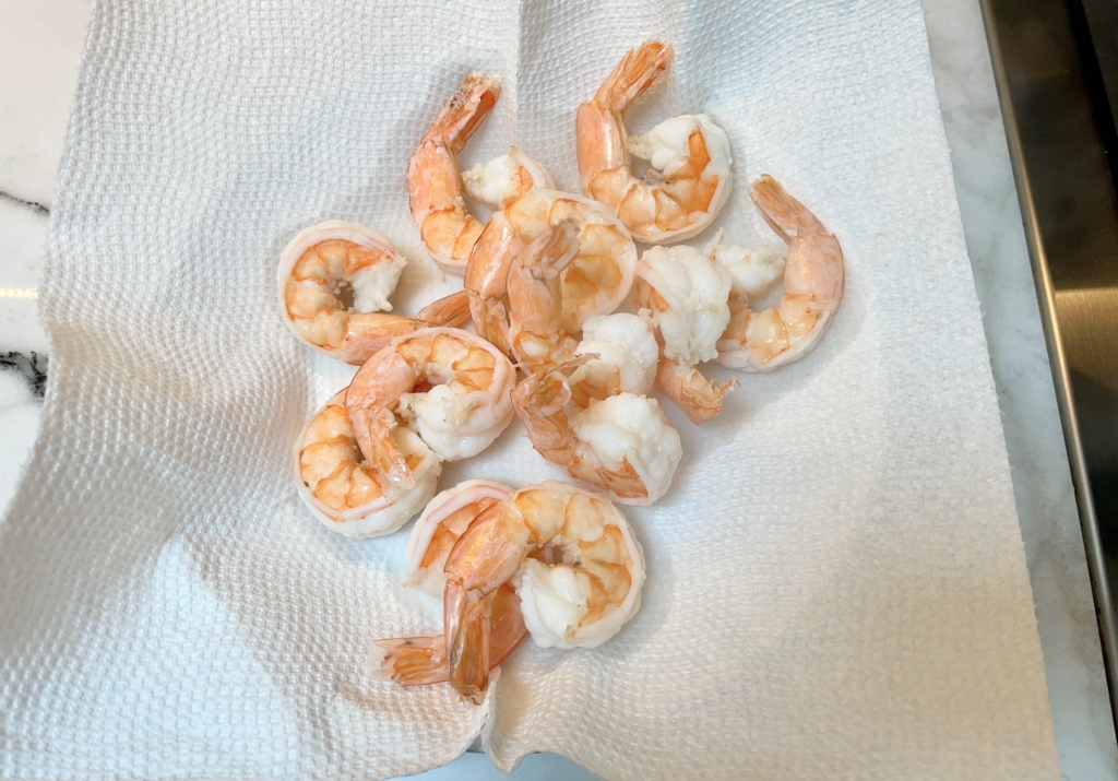 Remove shrimp with a slotted spoon and place on a towel-lined paper plate. Allow shrimp to cool for 10-15 minutes and then cover with plastic wrap and place in the refrigerator for at least one hour. The shrimp should be cold before serving.