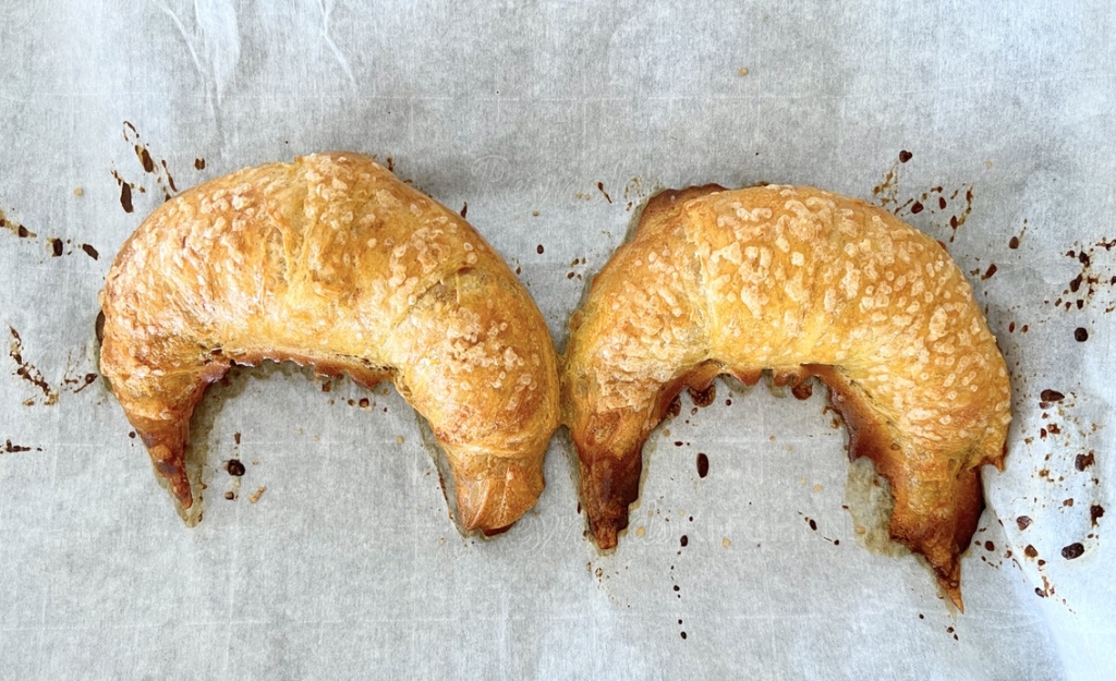 Transfer the croissants to a parchment-lined baking sheet and bake for 30-35 minutes or until croissants are golden, flaky, and puffed.