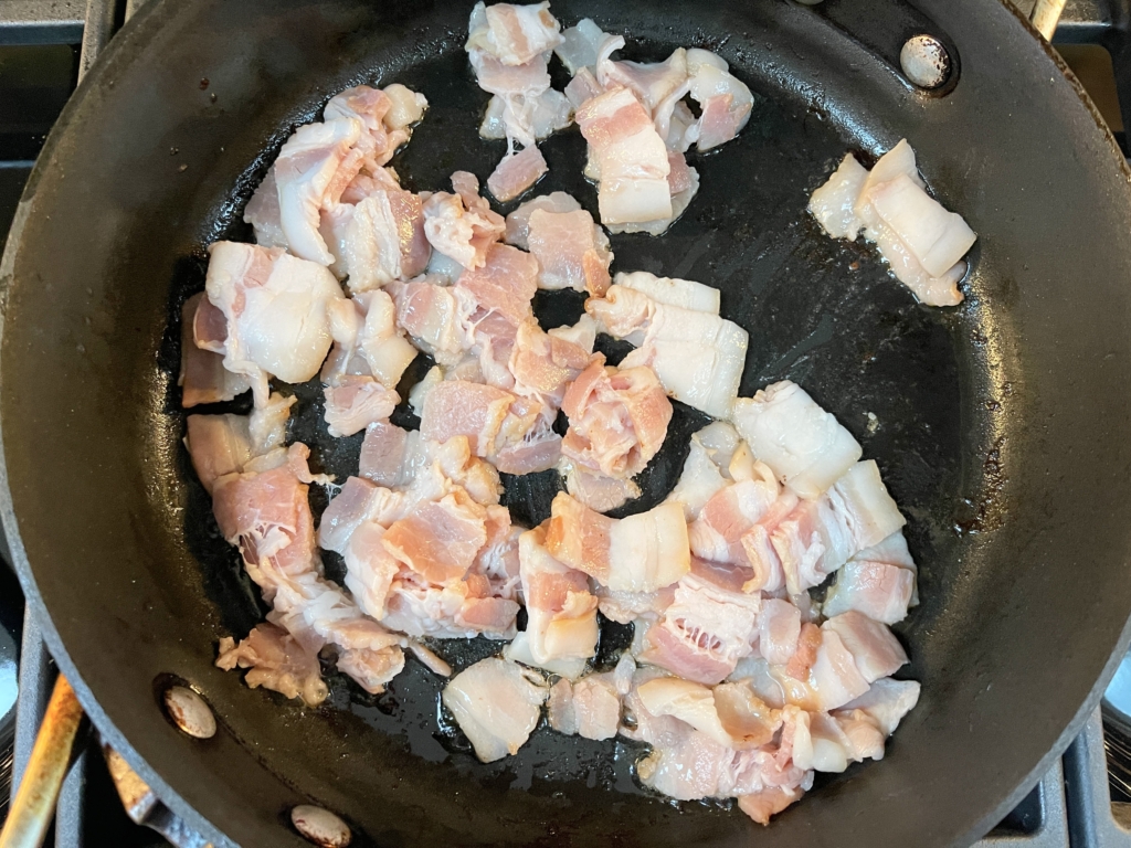 Cook bacon over medium low heat in a non-stick pan until brown and crisp, approx 9-11 mins. 

