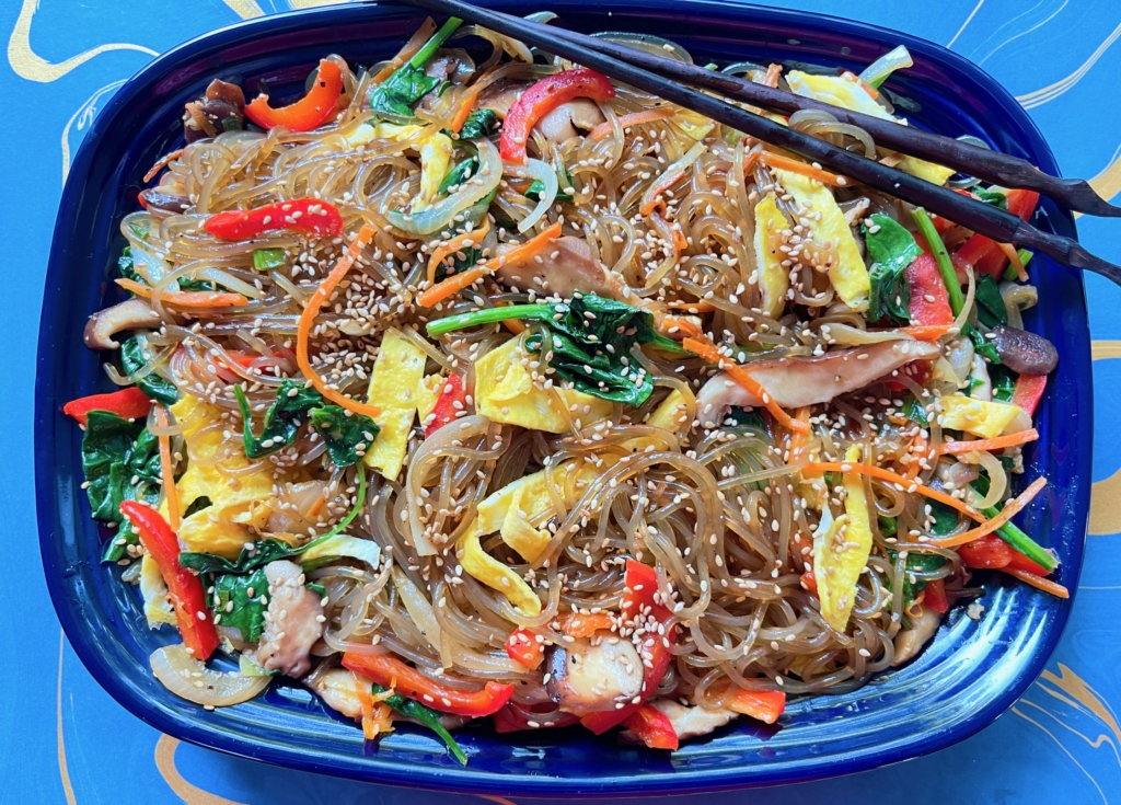 Transfer noodles to a bowl or platter, garnish with sesame seeds and dig in!