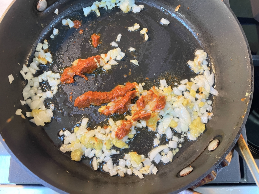  Then add the curry paste to the pan and cook for one minute. 