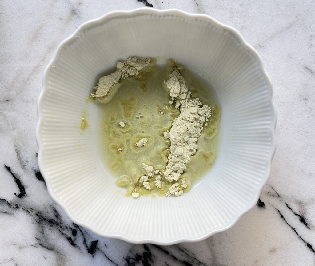 Place wasabi powder and water in a small bowl.