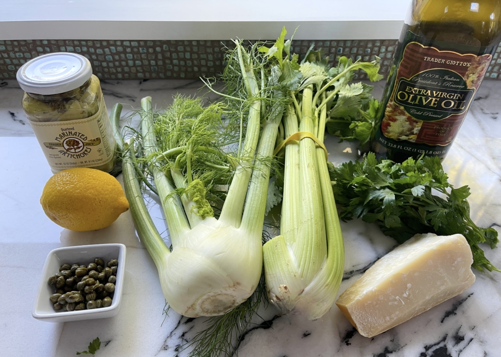 ingredients - celery, fennel, parmesan cheese, capers, artichoke hearts in oil, lemon juice, parsley, and extra virgin olive oil.