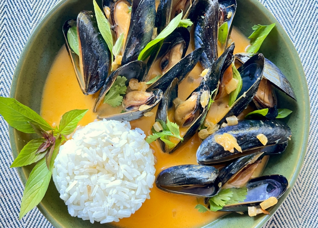 Thai Coconut Curry Mussels. Transfer mussels to a large, shallow bowl, or place in individual bowls. Garnish with cilantro and Thai basil and serve with a side of jasmine rice.