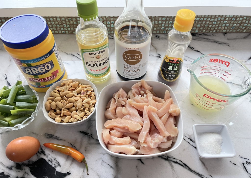 ingredients - boneless, skinless chicken, peanuts, egg white, sesame oil, cornstarch, scallions, chili pepper, red wine or rice vinegar, sugar, chicken broth, salt, and gluten free soy sauce.