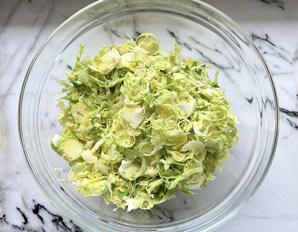 Transfer shaved Brussels sprouts to a large bowl 