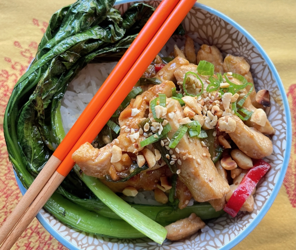 Transfer chicken to a platter or bowl and serve with rice and a green vegetable. Sprinkle any leftover peanuts and scallions on top.