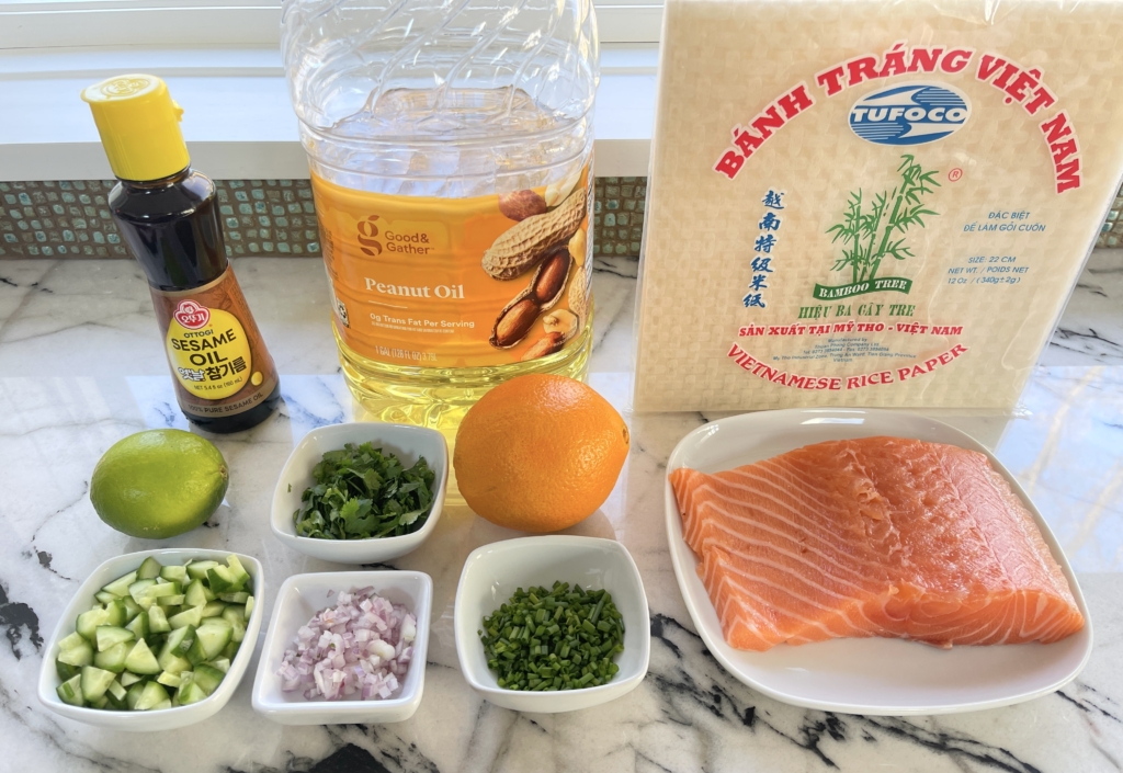 ingredients - salmon fillet, cilantro, chives, cucumbers, shallot, ginger, sesame oil, gluten free soy sauce, lime zest, orange zest, honey (or mirin), Vietnamese rice paper and peanut oil. Not photographed, whoops, ginger, honey/mirin, and gluten free soy sauce.