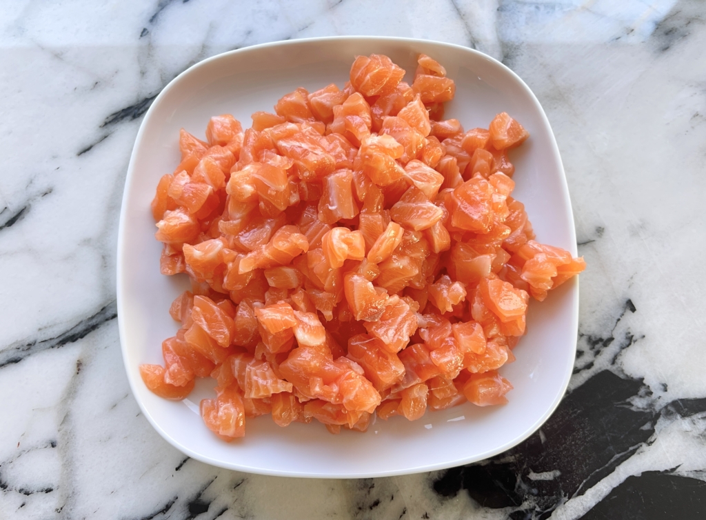 Cut salmon into small cubes.