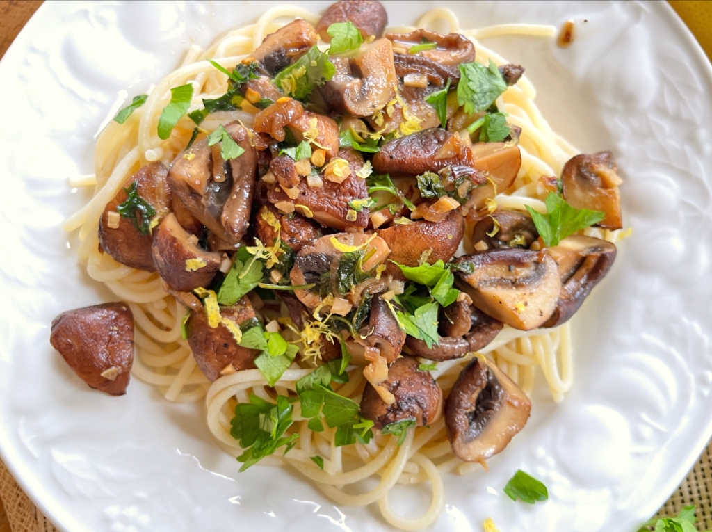 To serve, top mushrooms with remaining parsley, additional red pepper flakes if desired, and pair with pasta, rice or quinoa.
