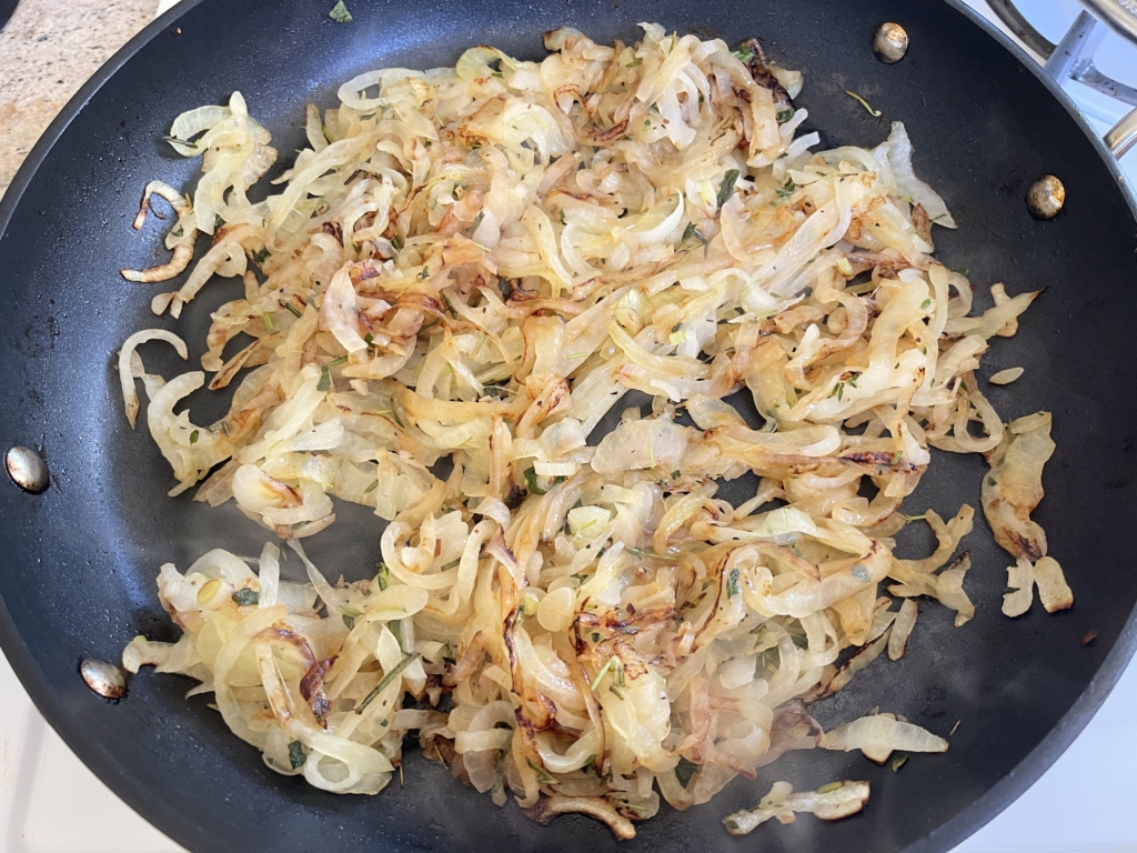 Stir occasionally and cook until onions are caramelized, approximately 15 mins. For added flavor, add 1/2 cup white wine and cook for an additional 5 mins, optional.