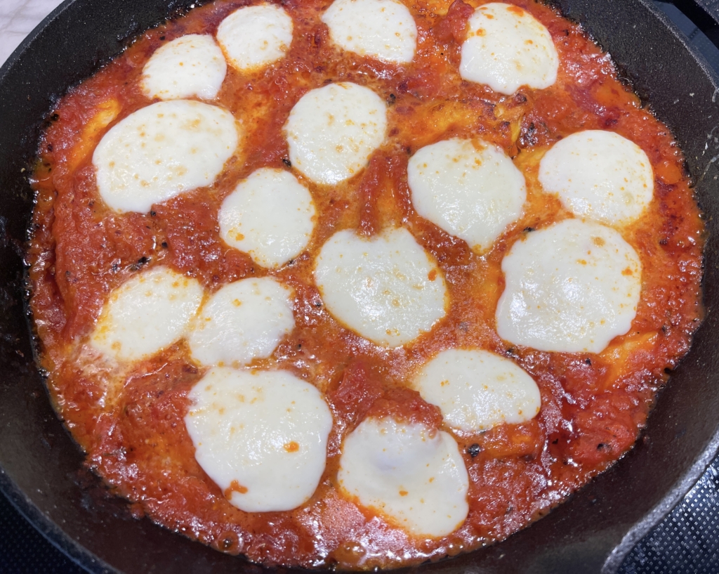 Carefully add chicken cutlets back into the pan, coating with the marinara sauce..Top chicken with fresh mozzarella and Parmesan. Place pan back in the oven on one of the top racks and broil for 2-3 mins, until cheese begins to melt and brown. Remove pan from oven.