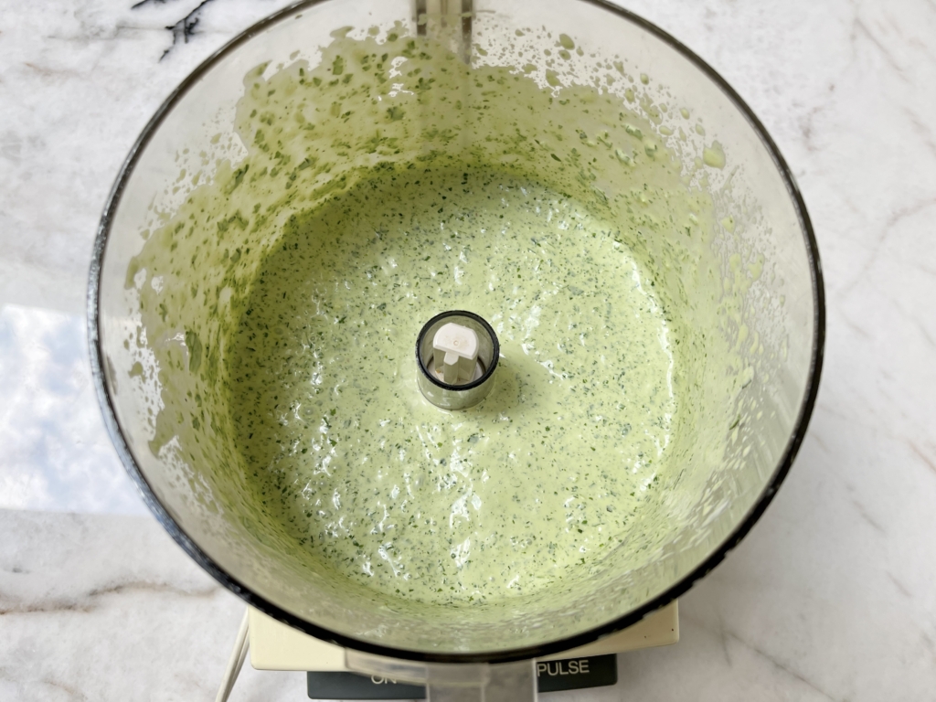 Process or blend ingredients together for 1 minute. You can blend it for shorter or longer depending on the consistency you’re looking for. Season with a pinch of kosher salt and some freshly ground black pepper.
