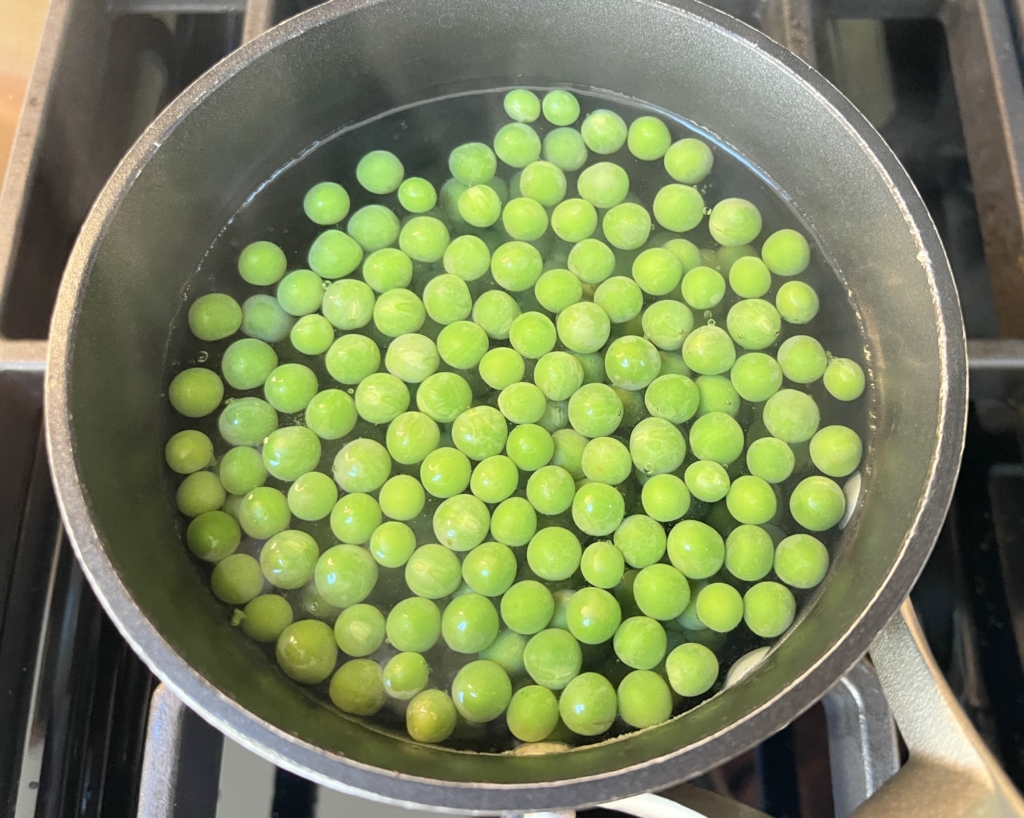 Place peas in boiling water for 1 minute.