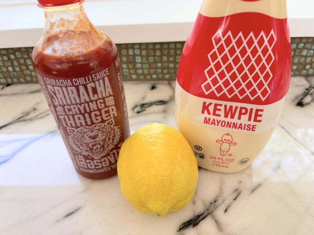 ingredients for the dipping sauce - Kewpie mayo, sriracha, and lemon.