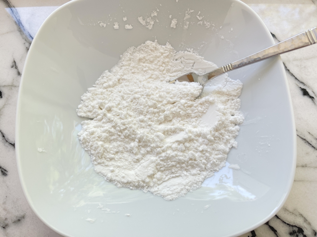 In a medium bowl, combine potato starch and rice flour.
