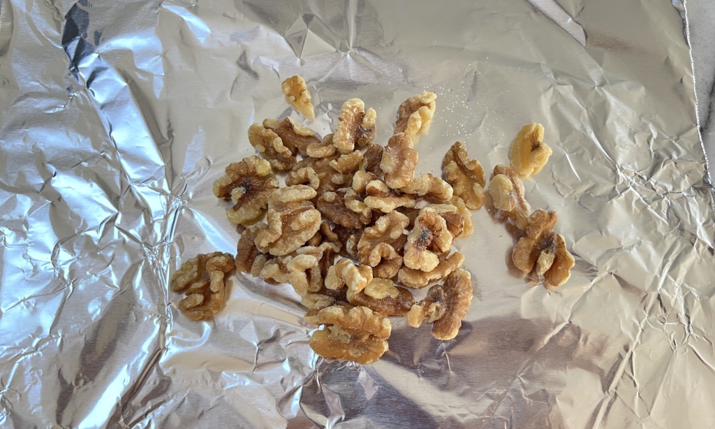 Place walnuts in a single layer on a tray lined with parchment paper or foil. Preheat oven to 350 degrees.