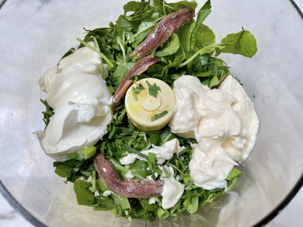 Place watercress, anchovies, mayo, sour cream, parsley, scallions, tarragon and white wine vinegar into a blender or food processor.