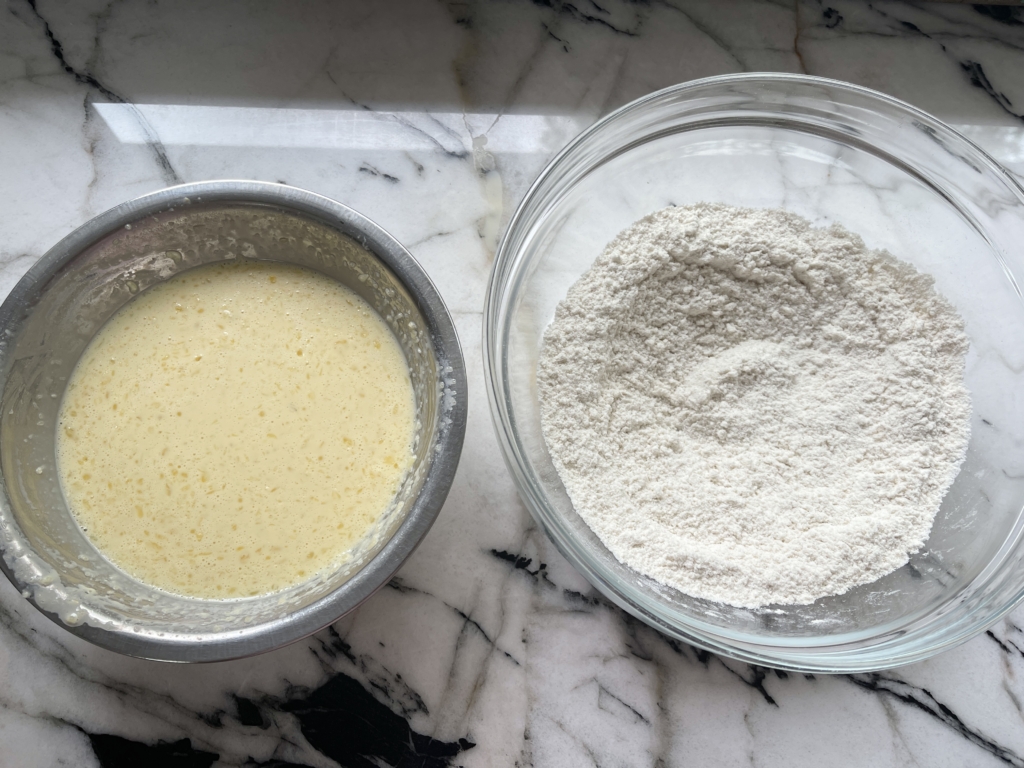 Whisk dry ingredients together in a large bowl…the gluten free flour, sugar, and salt. Whisk the wet ingredients together…the milk, eggs, melted butter, and vanilla.